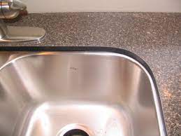 The edge of the flush mount sink sits with the countertop. Picture Of Laminate Undermount Sink