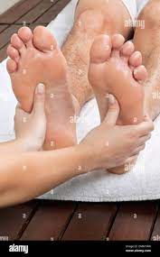 Man Receiving Foot Massage Stock Photo - Alamy