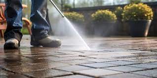 A thorough terrace cleaning using a powerful water pressure washer to remove grime from paving stones | Premium AI-generated image