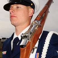 Engineman 1st Class Brandon Lovell is fitted for a combination cover by his  wife after being announced the 2017 Navy Reserve Sailor of the Year during  a ceremony at the U.S. Navy