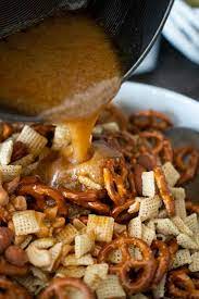 Pouring Toffee Mixture Over Snack Mix With Pretzels Chex Cereal Nuts Salty Snacks Mix Sweet And Salty Snack Mix Recipe Sweet And Salty Chex Mix Recipe