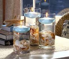 Beach decor can be created inexpensively and… Candles Beach Centerpieces Beach Theme Centerpieces Beach Wedding Centerpieces