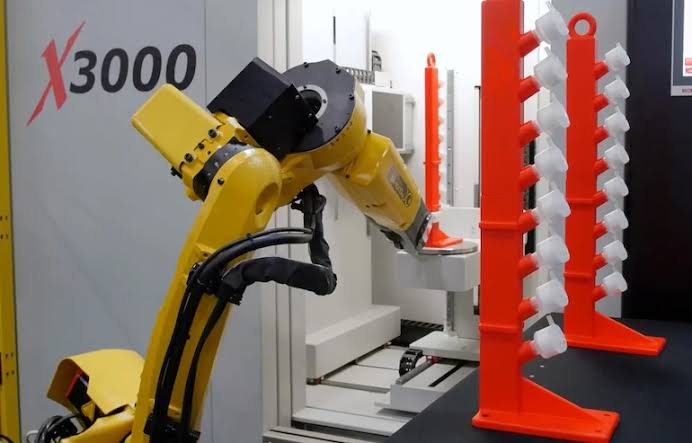 Dedicated fixed robotic machine tending arm, AI generated