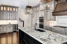 After slightly distressing these white kitchen cabinets, the design team at frankel building group applied an antique glaze. Distressed Kitchen Cabinets Transitional Kitchen Stonecroft Homes