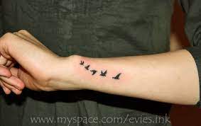 Womans Outer Forearm And Wristflying Birds Tattoo Flying Bird Tattoos Bird Tattoo Wrist Bird Tattoos Arm Outer Forearm Tattoo