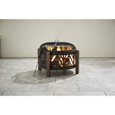 Fire pit covers and screens definitely earn a spot in the top 10 list. Garden Treasures 31 In W Black With Golden Brush Steel Wood Burning Fire Pit In The Wood Burning Fire Pits De Wood Burning Fires Wood Burning Fire Pit Fire Pit
