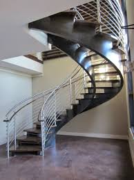The fabricated, hollow rods of wrought iron railings are usually chosen for a lighter, more delicate appearance. From Our Friends At Artistic Southern Indital Stainless Steel Newels Rails And Round Bar Make A St Staircase Design Stair Railing Design Steel Stair Railing