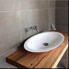 Black Bathroom Vanity With Timber Top White Oval Bench Mounted Basin On Hard Wood Timber Top Vanity Chrome Wall Mounted Tap And Mixer Timber Vanity Timber Bathroom Vanities Small Bathroom Vanities