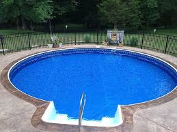 Radiant Metric Round Inground With Walk In Step And Stamped Concrete Inground Pool Designs Inground Pool Landscaping Backyard Pool Landscaping