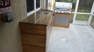 wood look tile outdoor bbq kitchen