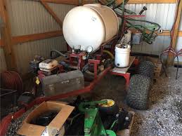 It has foldable boom arms, a removable axle, and wheels. Corteva Equipment Sales Atv Tow Behind Sprayer