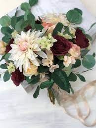 Silk flowers can be used to make a bridal bouquet that lasts forever, and it is very similar to arranging a fresh bouquet. Boho Burgundy Brides Bouquet Silk Flower Bridal Bouquet Bridesmaid Boho Bouquets Eucalyptus Dahlia Rose Hydrangea Thebridesbouquet Com
