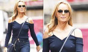 The britain's got talent host sat down with lady gaga and tony bennett and decided to take a leaf out of the bad romance singer's book. Amanda Holden 50 Goes Braless In Eye Popping Display As She Braves Wet Weather Celebrity News Showbiz Tv Express Co Uk