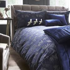 Crafted with a velour finish giving it a soft, velvety sheen, this red velvet bedspread brings glamour and comfort to your bed linen. Laurence Llewelyn Bowen Chic Navy Velvet Bedspread