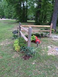 Since then, though, landscape timbers went way up in price and i was. Corner Accent Fence By Next Year The Running Roses And Clematis Should Running On The Fence Fence Landscaping Garden Fencing Driveway Landscaping