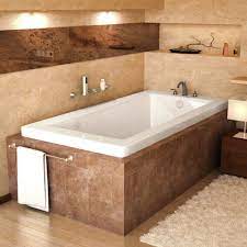 Custom master bathroom with jacuzzi tub and pedastal sinks. What To Know Before Buying A Whirlpool Bathtub Overstock Com