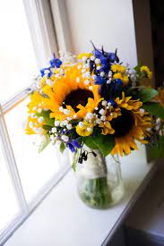 Your wedding day will undeniably be one of the most memorable moments in your life. Royal Blue Sunflower Yellow Summer Wedding Blue Wedding Flowers Wedding Centerpieces Sunflower Centerpieces
