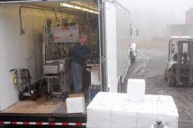 BOTTLING ROAD SHOW: Dundee winery owner offers mobile service at dozens of  sites around area