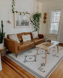 Black And White Rug Living Room I Couldn T Imagine A Better Rug To Tie This Place Together As Perfect As This Ruggable Damal In 2020 Leather Couches Living Room Black White Rug White Rug Living Room