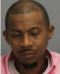 HONORARY DEPUTY: Joseph Chilton poses with Clayton County Sheriff Victor  Hill (left), after Hill says Chilton stepped in to stop an armed robbery at  a Hardee's where he was delivering bread this