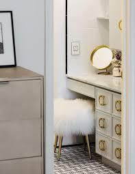 A Sheepskin Vanity Stool On Gold Legs Sits On Black And White Woven Pattern Floor Tiles At A Gray Apothecary Styl Vanity Stool Makeup Stool Diy Bathroom Vanity