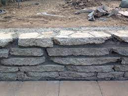 Comments (4) patch the cracked corner and find an artist who can paint the wall with concrete stain to look like a stone wall. Recycled Reclaimed Concrete Wall Made From Demolished Concrete Bbq Pad Recycled Concrete Landscaping Retaining Walls Concrete Retaining Walls