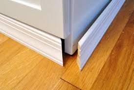 Although toe kicks are not required by building codes, they are a traditional design standard followed by manufacturers and tradesmen. Adding Molding To Cabinets To Make Them Look Built In Young House Love