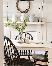 White Farmhouse Dining Room With Black Distressed Chairs Cozy Style Farmhouse Dining Room Table Dining Room Decor Modern Farmhouse Dining Set