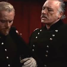 Here's one to ponder.... We think the man in this shot is Bob Custer...who  is the lady with him and what is the film? Thanks!