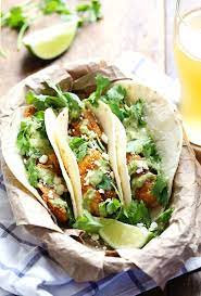 Fish tacos with creamy lime guacamole and cabbage slaw recipe. 5 Fun New Fish Tacos