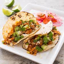 We invite you to come and taste it for yourself. Shredded Chicken Tacos Tinga De Pollo Cook S Illustrated Recipe Tasty Tacos Recipe Shredded Chicken Tacos Spicy Beef