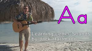 Group picture of teachers and teacher assistants holding up signs that read. Phonics Song Letter Sounds Alphabet Song Phonics Songs Educational Songs Jack Hartmann Place 4 Kids