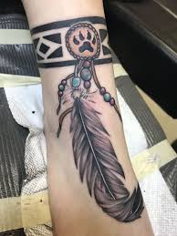 Creek Indian Band With A Lion Paw Medallion And Eagle Feather Courage And Beauty Native Indian Tattoos Tribal Tattoos For Women Indian Feather Tattoos