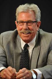 DAI defends work as budget cut looms