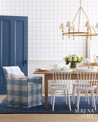 With Wooden Windsor Chairs And Windowpane Wallpaper This Blue And White Dining Room Is Classically Coastal Dining Room Beach House Interior White Dining Room