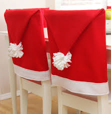 7 Ways To Decorate Your Dining Chairs For The Holidays Christmas Chair Covers Christmas Dining Chair Covers Christmas Chair