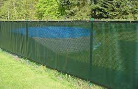 I.e., if you have some maiden grass, for example, in a nearby bed, repeat with it along your fence to create the sense that one bed flows into the other. Chain Link Fencing Landscaping Network