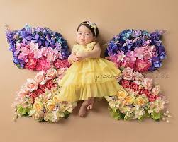 Beautiful Hispanic Baby Girl Lying On A Butterfly Flower Blanket Multicolored Rainbow Colors Roses Baby Photoshoot Girl Baby Photoshoot Baby Girl Photography