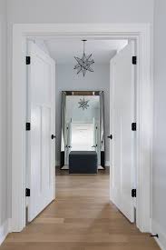 Master bedroom doors to to a backyard open with metal and glass finishings to red brick steps showcasing a furnished space on gravel surface. Interior Design Ideas Small Lot Modern Farmhouse Home Bunch Interior Design Ideas