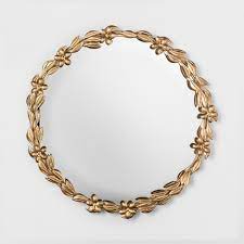 The circular shape takes the mirror from functional to decorative, with a host of frame options, from sleek and chic to vintage and brassy. Decorative Round Leaf Wall Mirror Gold Opalhouse Target