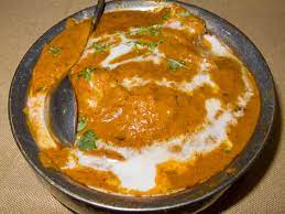 Indian butter chicken consists of pieces of tandoori chicken cooked in a tangy, velvety tomato cream sauce. Butter Chicken Delhi India Local Food Guide