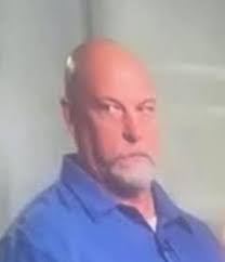 When outside, Higgins had the hoodie down.