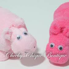 Each lollipop is made with 2 baby washcloths, decorated with ribbon to match and put in an actual lollipop wrap and coordinating ribbon to resemble an actual sucker. Washcloth Hippo Baby Shower Favors From Cheekychiqueboutique