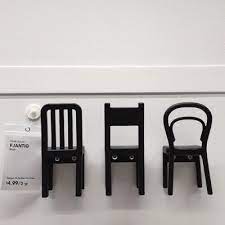 three ikea chair shaped hooks hanging on a wall with a price tag next to them ikea chair ikea inexpensive chairs