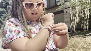 Little girl surprised with cake at memorial birthday party