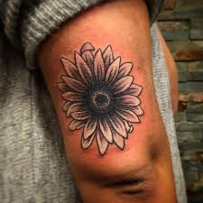 This sunflower tattoo looks very hippie although it is very simple and simple without any colors. 48 Unique Daisy Tattoos To Style Your Body