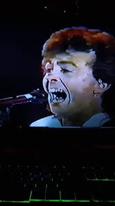 I'm watching The Outfield Mystery Man and 61 seconds live at Munich Germany  1986