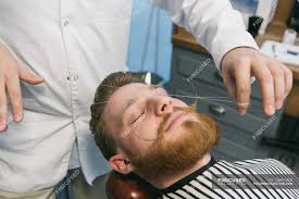 It is then rolled over areas of unwanted hair, plucking the hair at the follicle level. Traditional Facial Hair Threading Background Lifestyle Stock Photo 126875488