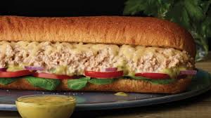 First, butter up the outer sides of your bread slices. Subway Designed A New Tuna Sandwich With Tastemade