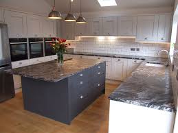 The two shaker cabinet drawers are paired with hanging cabinets with glass handles. Grey Graphite Oakgrain Grey Shaker Hallmark Kitchen Designs